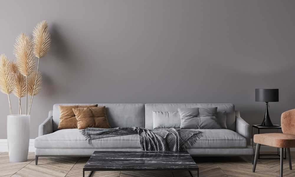 Add Pillows And Throws To The Dark Gray Sofa